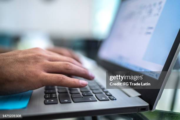 close-up of man using laptop at home - spreadsheet stock pictures, royalty-free photos & images