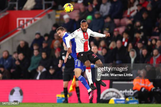 Timothy Castagne of Leicester City and Theo Walcott of Southampton battle for a header during the Premier League match between Southampton FC and...