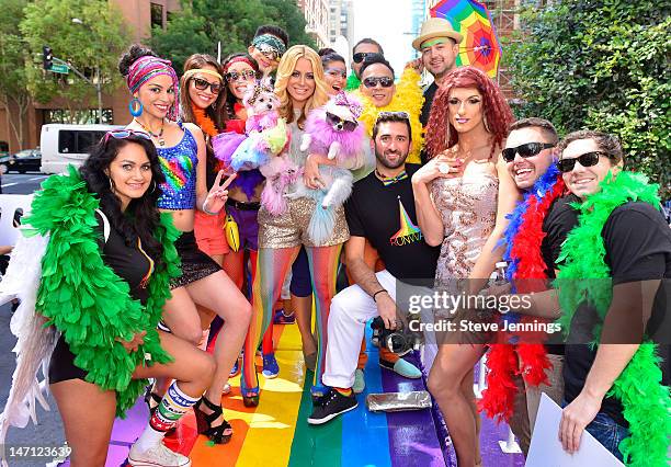 Aubrey O'Day holding her dogs Ginger and Mary Ann appears on the Virgin America "Ride With Pride" Float at the Gay Pride Parade on June 24, 2012 in...