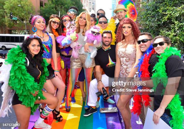 Aubrey O'Day holding her dogs Ginger and Mary Ann appears on the Virgin America "Ride With Pride" Float at the Gay Pride Parade on June 24, 2012 in...