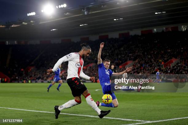 Timothy Castagne of Leicester City has a penalty awarded against him as the ball strikes his arm inside the box from a cross by Theo Walcott of...