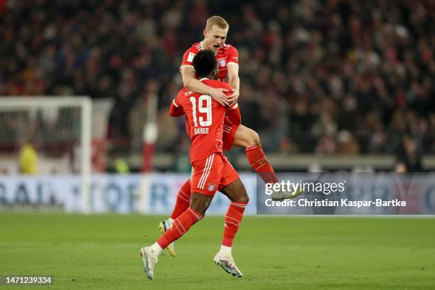 Matthijs de Ligt of FC Bayern Munich celebrates with teammate Alphonso Davies after scoring the team's first goal during the Bundesliga match between...