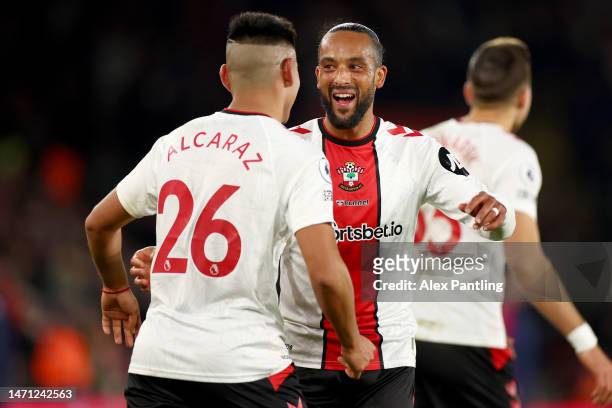 Carlos Alcaraz of Southampton celebrates with teammate Theo Walcott after scoring the team's first goal during the Premier League match between...