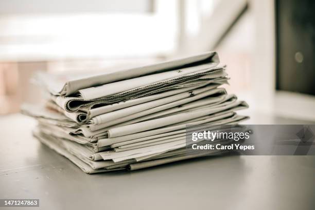 stack of newspapers for recycling - news background stock pictures, royalty-free photos & images