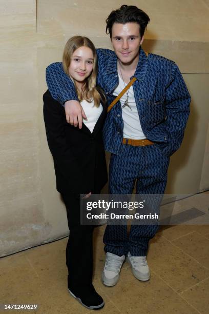 Harper Beckham and Cruz Beckham attend the Victoria Beckham FW23 show during Paris fashion week on March 03, 2023 in Paris, France.