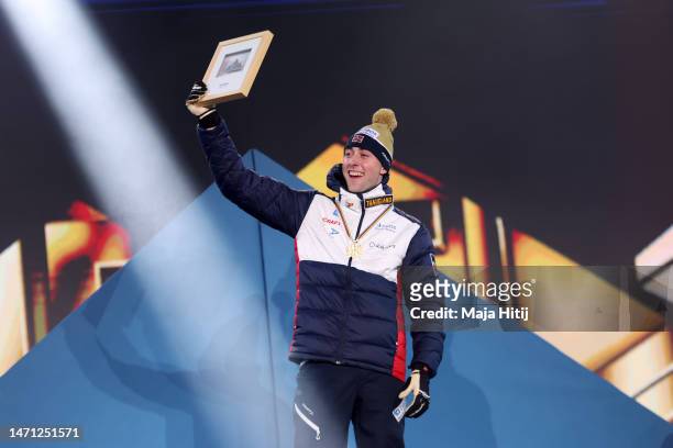 Gold medalist Jarl Magnus Riiber of Norway celebrates during the medal ceremony for Nordic Combined Men's Gundersen Large Hill HS138/10km at the FIS...