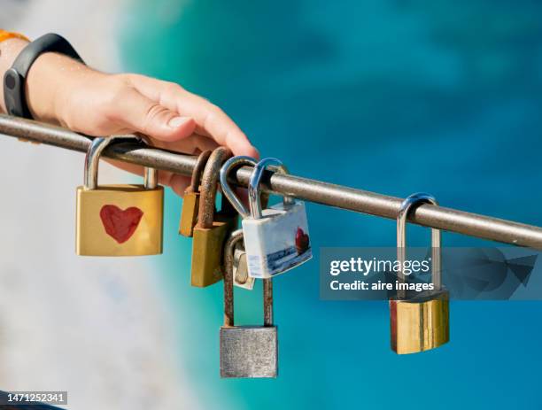 padlocks in in myrtos beach, argostoli, kefalonia island, greece. - love padlocks stock pictures, royalty-free photos & images