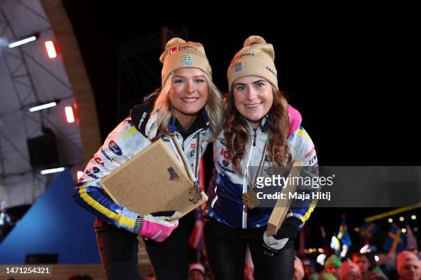 Gold medalist Ebba Andersson of Sweden and bronze medalist Frida Karlsson of Sweden pose for a photo after the Cross-Country Women's 30km Mass Start...