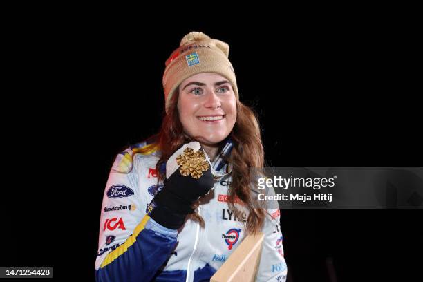 Gold medalist Ebba Andersson of Sweden poses for a photo during the medal ceremony for Cross-Country Women's 30km Mass Start Classic at the FIS...