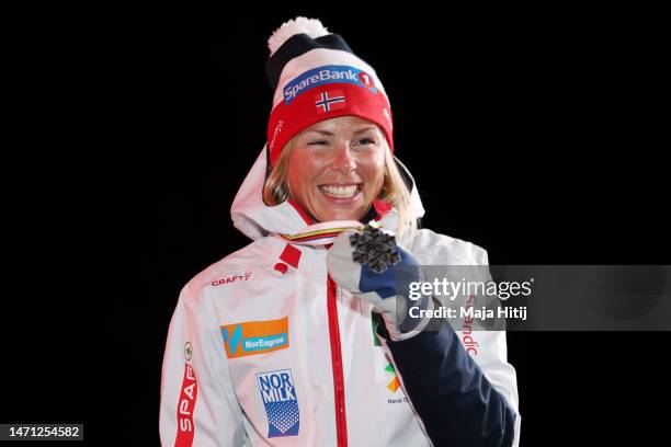 Silver medalist Anne Kjersti Kalvaa of Norway poses for a photo during the victory ceremony for Cross-Country Women's 30km Mass Start Classic at the...
