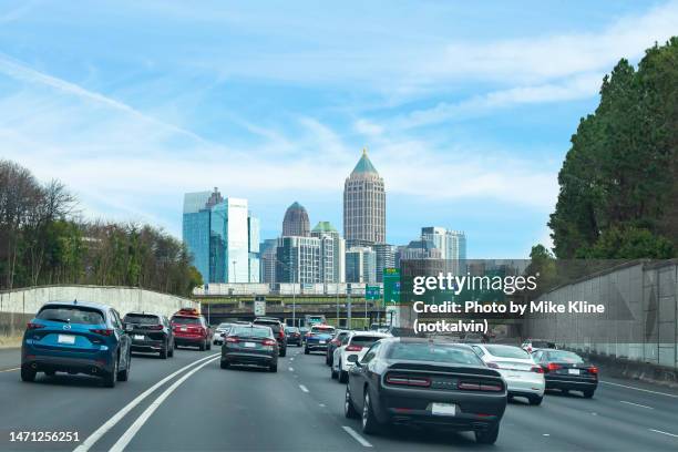 arriving in atlanta - atlanta skyline car stock pictures, royalty-free photos & images