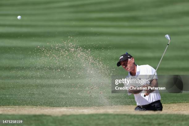 Corey Pavin of the United States chips from the bunker on the 17th green during round two of the Cologuard Classic at Omni Tucson National on March...