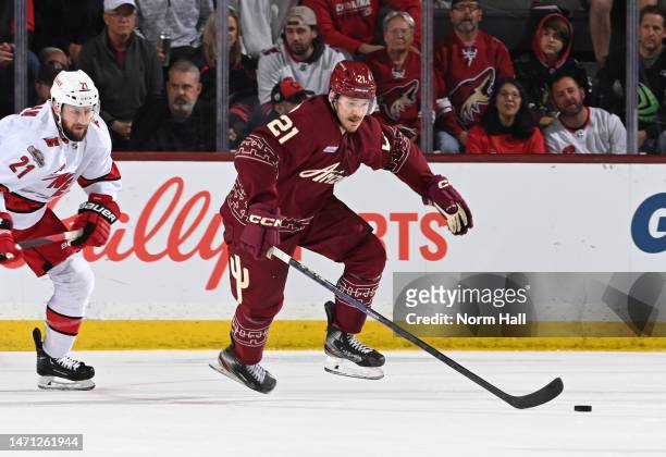 Milos Kelemen of the Arizona Coyotes skates with the puck against the Carolina Hurricanes at Mullett Arena on March 03, 2023 in Tempe, Arizona.