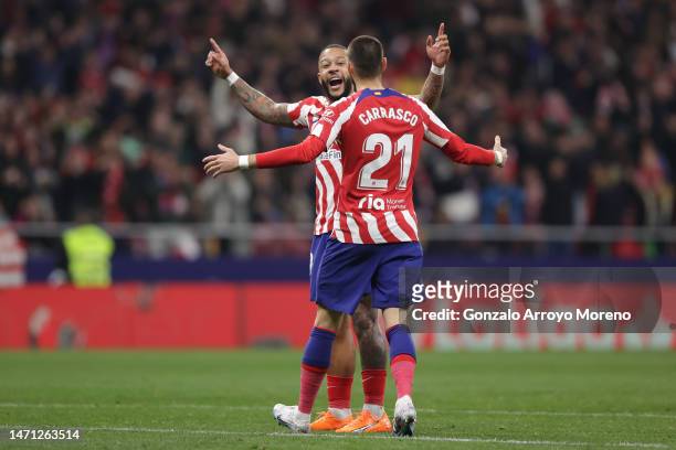 Memphis Depay of Atletico de Madrid celebrates scoring their second goal with teammate Yannick Carrasco during the LaLiga Santander match between...