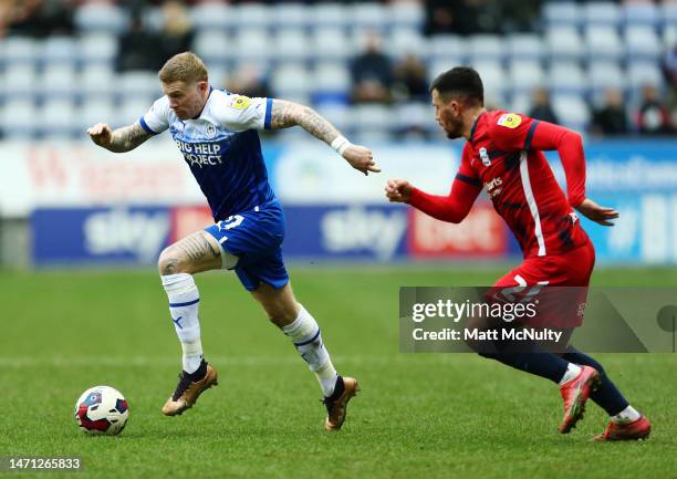 James McClean of Wigan Athletic dribbles past Maxime Colin of Birmingham City during the Sky Bet Championship between Wigan Athletic and Birmingham...
