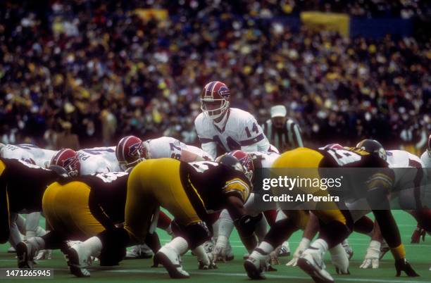 Quarterback Frank Reich of the Buffalo Bills calls a play in the game between the Buffalo Bills vs the Pittsburgh Steelers AFC Divisional Playoff...