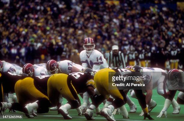 Quarterback Frank Reich of the Buffalo Bills calls a play in the game between the Buffalo Bills vs the Pittsburgh Steelers AFC Divisional Playoff...