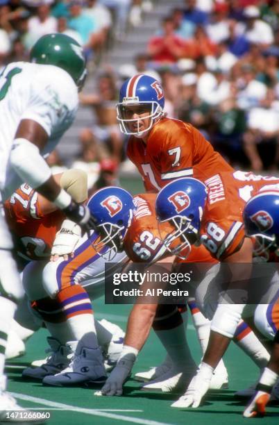 Quarterback John Elway of the Denver Broncos calls a play in the game between the Denver Broncos vs the Philadelphia Eagles at Veterans Stadium on...