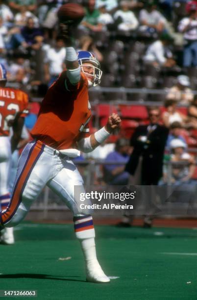 Quarterback John Elway of the Denver Broncos passes the ball in the game between the Denver Broncos vs the Philadelphia Eagles at Veterans Stadium on...