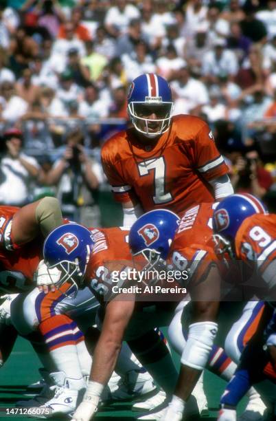 Quarterback John Elway of the Denver Broncos calls a play in the game between the Denver Broncos vs the Philadelphia Eagles at Veterans Stadium on...