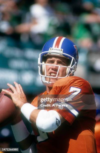 Quarterback John Elway of the Denver Broncos passes the ball in the game between the Denver Broncos vs the Philadelphia Eagles at Veterans Stadium on...