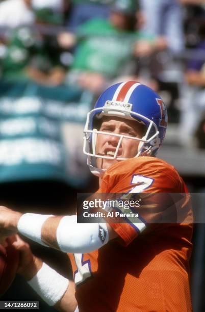 Quarterback John Elway of the Denver Broncos passes the ball in the game between the Denver Broncos vs the Philadelphia Eagles at Veterans Stadium on...