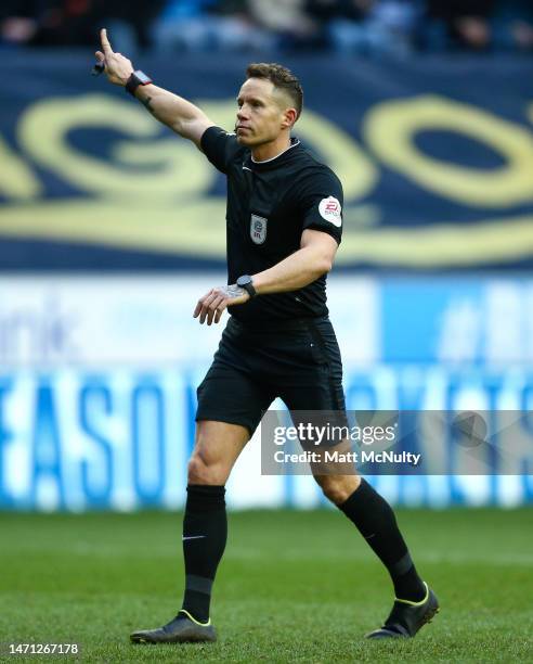 Referee Steve Martin points during the Sky Bet Championship between Wigan Athletic and Birmingham City at DW Stadium on March 04, 2023 in Wigan,...