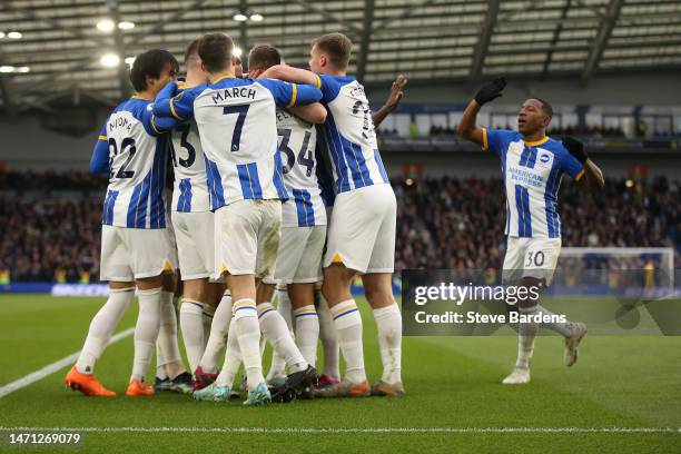 Joel Veltman of Brighton & Hove Albion celebrates with teammates after scoring the team's second goal during the Premier League match between...