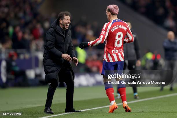 Antoine Griezmann of Atletico de Madrid celebrates after scoring their third side goal with Diego Simeone during the LaLiga Santander match between...