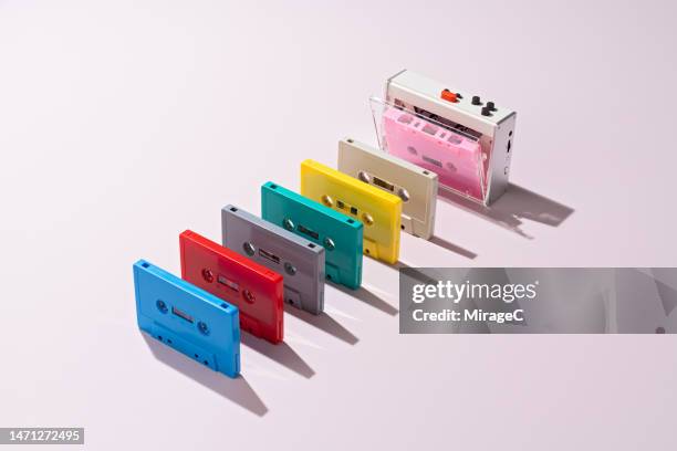 audio cassette player with colorful cassette tapes, music style - pop music stock-fotos und bilder