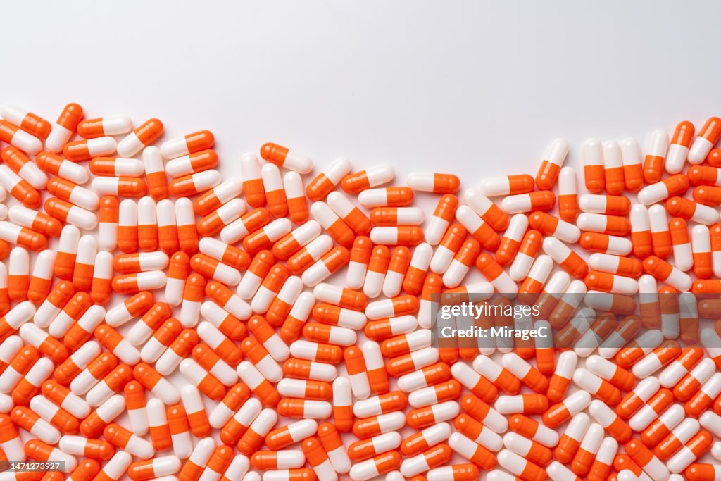 Abundance of Orange Colored Capsule Pills