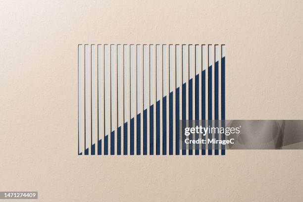 ascending blue bar chart moving up paper cut craft - liniendiagramm stock-fotos und bilder
