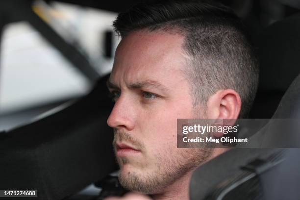 Alex Bowman, driver of the Ally Chevrolet, sits in his car during practice for the NASCAR Cup Series Pennzoil 400 at Las Vegas Motor Speedway on...