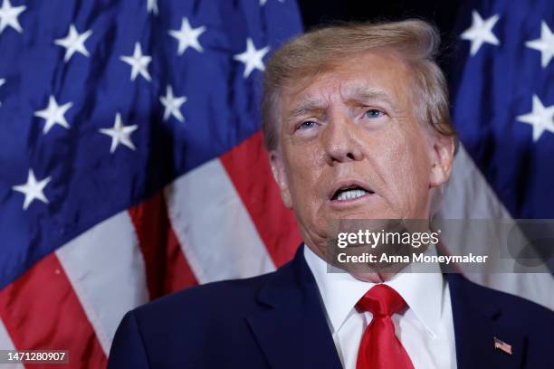 Former U.S. President Donald Trump speaks to reporters before his speech at the annual Conservative Political Action Conference at Gaylord National...