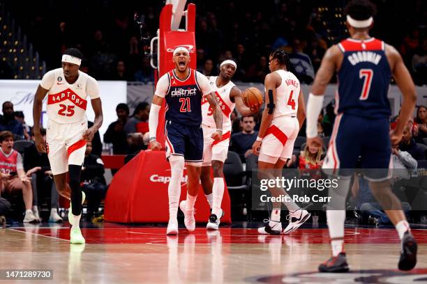 Daniel Gafford of the Washington Wizards celebrates after scoring against the Toronto Raptors in the first half at Capital One Arena on March 04,...