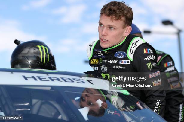 Riley Herbst, driver of the Monster Energy Ford, enters his car prior to the NASCAR Xfinity Series Alsco Uniforms 300 at Las Vegas Motor Speedway on...