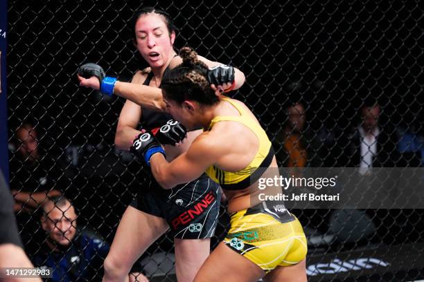 Tabatha Ricci of Brazil punches Jessica Penne in a strawweight fight during the UFC 285 event at T-Mobile Arena on March 04, 2023 in Las Vegas,...