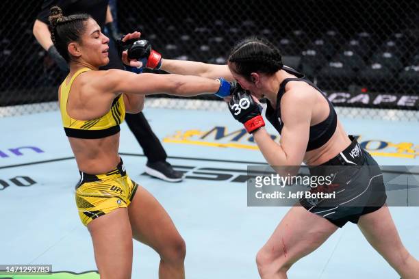 Tabatha Ricci of Brazil punches Jessica Penne in a strawweight fight during the UFC 285 event at T-Mobile Arena on March 04, 2023 in Las Vegas,...