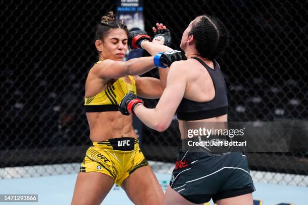 Tabatha Ricci of Brazil and Jessica Penne trade punches in a strawweight fight during the UFC 285 event at T-Mobile Arena on March 04, 2023 in Las...