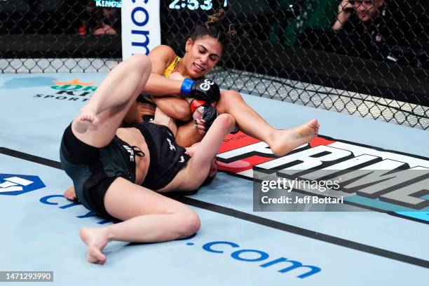 Tabatha Ricci of Brazil wrestles Jessica Penne in a strawweight fight during the UFC 285 event at T-Mobile Arena on March 04, 2023 in Las Vegas,...