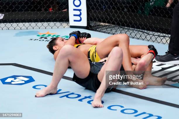 Tabatha Ricci of Brazil wrestles Jessica Penne in a strawweight fight during the UFC 285 event at T-Mobile Arena on March 04, 2023 in Las Vegas,...