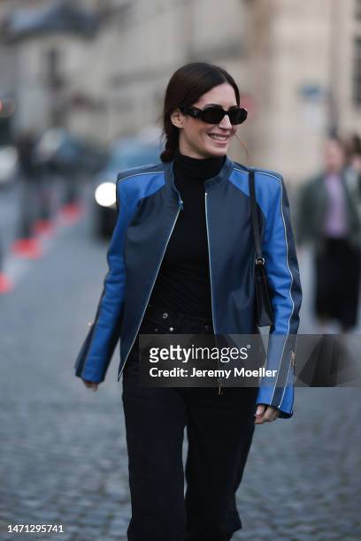 Gala Gonzalez seen wearing a black and blue biker leather jacket, black turtleneck and black pants and sunglasses and black heels outside Victoria...