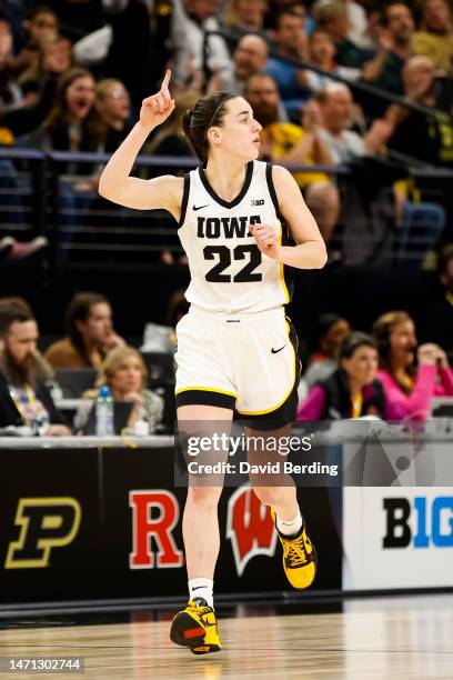 Caitlin Clark of the Iowa Hawkeyes celebrates her basket against the Maryland Terrapins in the second half of the game in the semifinals of the Big...