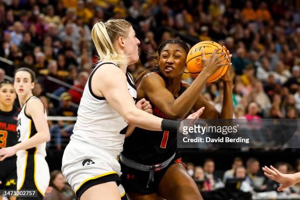 Diamond Miller of the Maryland Terrapins goes to the basket while Monika Czinano of the Iowa Hawkeyes defends in the second half of the game in the...