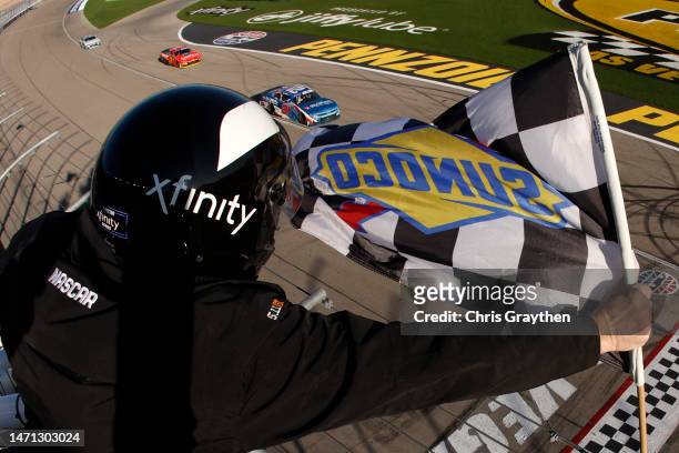 Austin Hill, driver of the Global Industrial Chevrolet, takes the checkered flag to win the NASCAR Xfinity Series Alsco Uniforms 300 at Las Vegas...