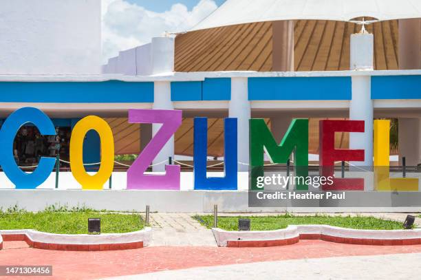 colorful cozumel sign in the downtown district of the tourist island in mexico - cozumel mexico stock pictures, royalty-free photos & images