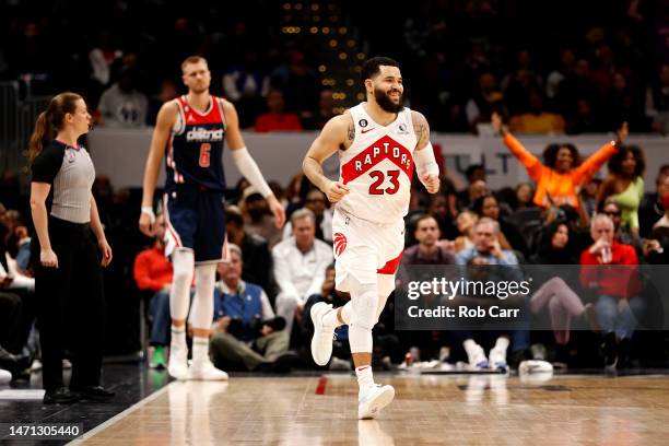 Fred VanVleet of the Toronto Raptors celebrates in front of Kristaps Porzingis of the Washington Wizards after hitting a three pointer in overtime at...