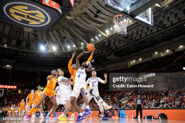 Flau'jae Johnson of the LSU Lady Tigers and Jasmine Franklin of the Tennessee Lady Vols reach for a rebound in the second quarter during the...