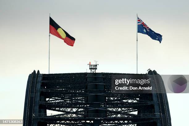 The Aboriginal and Australian flags are seen flying on March 05, 2023 in Sydney, Australia. Around 50,000 people walked across the Sydney Harbour...