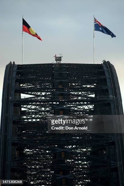 The Aboriginal and Australian flags are seen flying on March 05, 2023 in Sydney, Australia. Around 50,000 people walked across the Sydney Harbour...